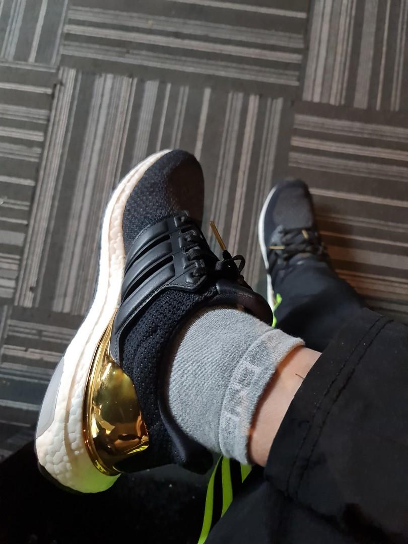 Ultra boost gold outlet medal on foot