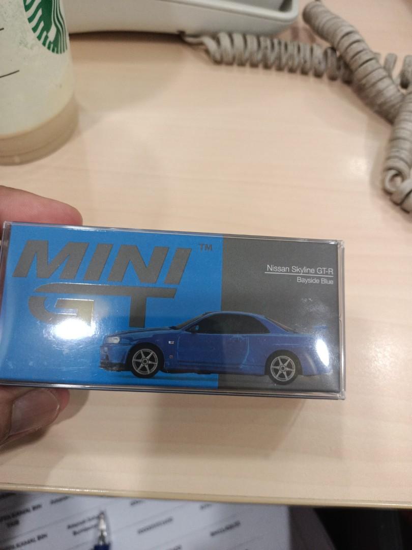 1:64 Scale Mini GT Nissan Skyline GT-R (R34) V Spec II Bayside Blue #341,  Hobbies  Toys, Toys  Games on Carousell